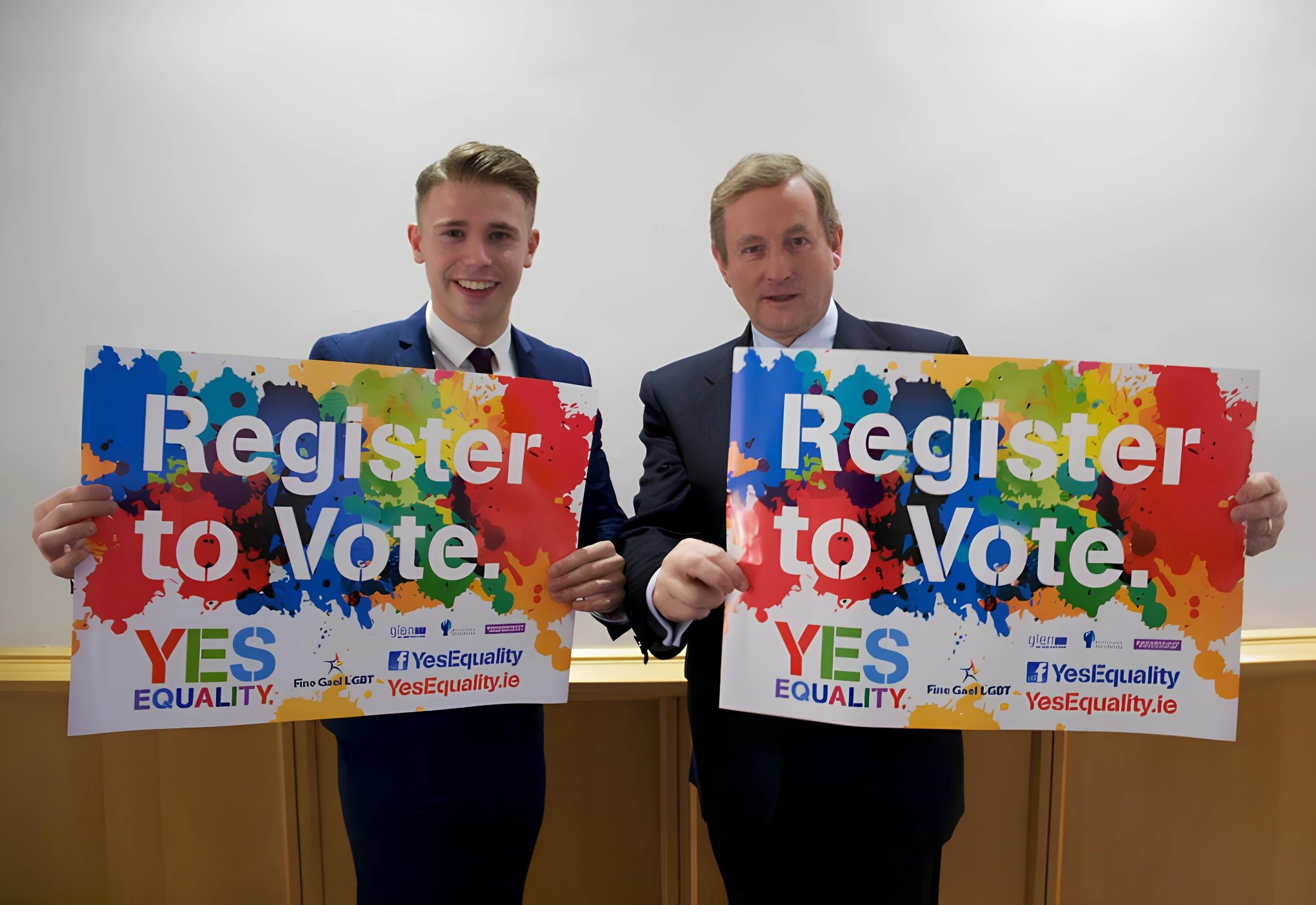 Dale McDermott and Taoiseach Enda Kenny holding Yes Equality Register to Vote posters ahead of Ireland's 2015 marriage equality referendum